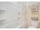 Bathroom showcasing white shower with tub, toilet and towel bar with clean, minimalist design for relaxation at 967 Henry James Dr., Myrtle Beach, SC 29579