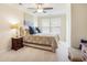 Cozy bedroom with ceiling fan, large windows, and neutral tones, perfect for relaxation and rest at 967 Henry James Dr., Myrtle Beach, SC 29579