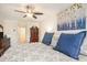 Comfortable main bedroom showcasing ceiling fan, artwork, and decorative pillows, creating a serene ambiance at 967 Henry James Dr., Myrtle Beach, SC 29579