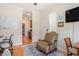 Bright office space with hardwood floors, white walls, and a comfortable sitting area adjacent to the open floor plan at 967 Henry James Dr., Myrtle Beach, SC 29579