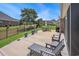 Spacious patio includes outdoor seating, a dining area with a grill, and a manicured lawn with fenced yard at 967 Henry James Dr., Myrtle Beach, SC 29579