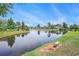 Picturesque pond with calm waters and lush landscaping, framed by mature trees and well-kept lawns at 967 Henry James Dr., Myrtle Beach, SC 29579