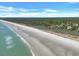 Sweeping aerial of beach meets tree-lined waterfront neighborhood at 101 Ocean Creek Dr. # Dd7, Myrtle Beach, SC 29572