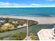 Beautiful aerial view of the beach with a pier and oceanfront pool at 101 Ocean Creek Dr. # Dd7, Myrtle Beach, SC 29572