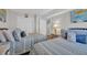 Bright bedroom featuring two beds, a bedside table, and closet, creating a comfortable space at 101 Ocean Creek Dr. # Dd7, Myrtle Beach, SC 29572