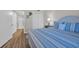 Comfortable bedroom with a single bed, blue bedding, closet and bathroom access providing convenience at 101 Ocean Creek Dr. # Dd7, Myrtle Beach, SC 29572