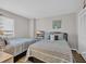Inviting bedroom featuring two beds, a TV, and closet, creating a cozy and functional space at 101 Ocean Creek Dr. # Dd7, Myrtle Beach, SC 29572