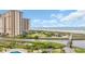 Aerial view showcasing the ocean, landscaping, and a tall high-rise building with multiple balconies at 101 Ocean Creek Dr. # Dd7, Myrtle Beach, SC 29572