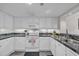 Well-lit kitchen featuring white cabinets, modern appliances, and sleek countertops for cooking at 101 Ocean Creek Dr. # Dd7, Myrtle Beach, SC 29572