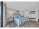 Bright main bedroom features a coastal theme, king bed, and an attached bathroom, creating a relaxing retreat at 101 Ocean Creek Dr. # Dd7, Myrtle Beach, SC 29572