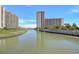 Picturesque views of waterfront landscape, buildings, and dock at 101 Ocean Creek Dr. # Dd7, Myrtle Beach, SC 29572