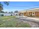 Well-maintained backyard features a patio, white picket fence, green lawn and comfortable seating at 1014 Thomas Ave., North Myrtle Beach, SC 29582