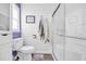 Renovated bathroom with shiplap walls, modern shower, and stylish fixtures offers a clean, spa-like atmosphere at 1014 Thomas Ave., North Myrtle Beach, SC 29582