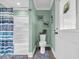 Bathroom with a shower, toilet, and access to the door at 1014 Thomas Ave., North Myrtle Beach, SC 29582
