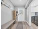 Inviting entryway with bench seating, wood-look floors, and nautical-themed decor create a welcoming atmosphere at 1014 Thomas Ave., North Myrtle Beach, SC 29582