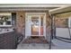Charming front entryway features brick accents, covered porch and welcome mat at 1014 Thomas Ave., North Myrtle Beach, SC 29582