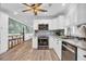 Modern kitchen with stainless steel appliances, white cabinetry, and mosaic tile backsplash at 1014 Thomas Ave., North Myrtle Beach, SC 29582