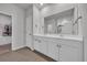 Bathroom featuring double sinks, white cabinets, and ceramic tile flooring at 112 Carolina Lakes Blvd., Myrtle Beach, SC 29588