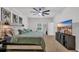 Cozy bedroom with an inviting bed, ceiling fan, and large TV for ultimate relaxation and entertainment at 112 Carolina Lakes Blvd., Myrtle Beach, SC 29588