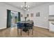 Bright dining area with stylish lighting, a modern table, and views of the backyard at 112 Carolina Lakes Blvd., Myrtle Beach, SC 29588
