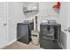 Laundry room with washer, dryer, and shelving at 112 Carolina Lakes Blvd., Myrtle Beach, SC 29588