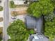 Aerial shot of property showcasing the roof, yard, and surrounding trees at 113 Woodland Dr., Murrells Inlet, SC 29576