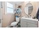 Neat bathroom with updated fixtures and a round mirror at 113 Woodland Dr., Murrells Inlet, SC 29576