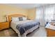 Cozy bedroom with wood-look floors, soft lighting, and comfortable furnishings at 113 Woodland Dr., Murrells Inlet, SC 29576