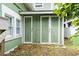 Outdoor shed with double doors offers additional storage space at 113 Woodland Dr., Murrells Inlet, SC 29576