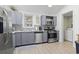 Well-equipped kitchen with stainless steel appliances, wood-look floors, and ample counter space, perfect for cooking at 113 Woodland Dr., Murrells Inlet, SC 29576