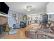 Cozy living room that flows into the kitchen; complete with a brick fireplace at 113 Woodland Dr., Murrells Inlet, SC 29576