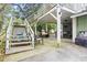 Backyard patio featuring stairs, a sitting area, and outdoor dining under a deck at 113 Woodland Dr., Murrells Inlet, SC 29576