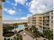 Scenic aerial view of the condo complex with a pool, lush landscaping, and ocean views at 125 South Dunes Dr., Pawleys Island, SC 29585
