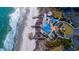 Aerial view of the community center on the beach with blue roof, boardwalk and ample parking at 125 South Dunes Dr., Pawleys Island, SC 29585