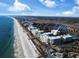 Panoramic aerial view featuring beachfront condo community along a scenic coastline at 125 South Dunes Dr., Pawleys Island, SC 29585