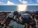 Stunning aerial view of a beachfront condo complex with tennis courts and ocean views at 125 South Dunes Dr., Pawleys Island, SC 29585