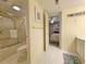 Bathroom with a shower/tub combo with tile surround, toilet, and vanity with a large mirror at 125 South Dunes Dr., Pawleys Island, SC 29585