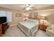 Cozy bedroom with a queen-sized bed, ceiling fan, and neutral decor at 125 South Dunes Dr., Pawleys Island, SC 29585