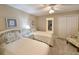 Bedroom with twin beds, neutral walls, and a closet with sliding doors at 125 South Dunes Dr., Pawleys Island, SC 29585