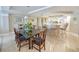 Charming dining area adjacent to the kitchen with glass top table and seating for eight at 125 South Dunes Dr., Pawleys Island, SC 29585