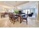 Elegant dining room with a glass-top table and wood chairs, adjacent to the living area at 125 South Dunes Dr., Pawleys Island, SC 29585