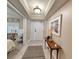 Inviting entryway featuring tile flooring and a decorative table with a lamp, showcasing style at 125 South Dunes Dr., Pawleys Island, SC 29585