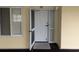 Unit 309 entryway features a storm door, neutral decor, and exterior window at 125 South Dunes Dr., Pawleys Island, SC 29585