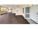 Well-lit hallway with carpet flooring leading to the unit's entrance, with exits nearby at 125 South Dunes Dr., Pawleys Island, SC 29585