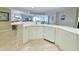 Bright kitchen features a breakfast bar with modern appliances and cabinetry at 125 South Dunes Dr., Pawleys Island, SC 29585