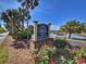 Community sign for Marsh Overlook Dock Fishing Pier with well-maintained landscaping and flowers at 125 South Dunes Dr., Pawleys Island, SC 29585