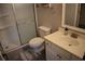 Well-lit bathroom with a tiled shower, toilet, and a vanity with ample counter space at 1266 River Oaks Dr. # 12-F, Myrtle Beach, SC 29579