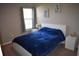 Bright bedroom with a comfortable bed, coastal decor, and natural light at 1266 River Oaks Dr. # 12-F, Myrtle Beach, SC 29579