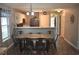 Bright dining area with a wooden table, seating for six, and views into the kitchen at 1266 River Oaks Dr. # 12-F, Myrtle Beach, SC 29579