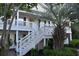 Inviting condo exterior with building number, stairs, and well-maintained landscaping at 1266 River Oaks Dr. # 12-F, Myrtle Beach, SC 29579
